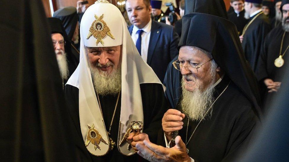 Greek Orthodox Ecumenical Patriarch Bartholomew I (R) and members of the clergy greet Patriarch of Moscow and All Russia Kirill (C) at St George church, the main Greek Orthodox cathedral during his visit on August 31, 2018 in Istanbul.