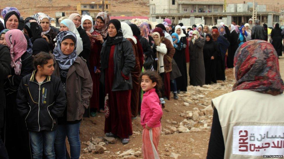 Syrian refugees wait to register upon their arrival in the strategic Lebanese border district town of Arsal on November 18, 2013, after fleeing the fighting in the neighbouring Syria.