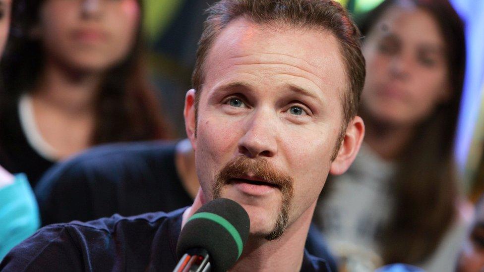 Morgan Spurlock of the appears on stage during MTV's Total Request Live at the MTV Times Square Studios July 7, 2004 in New York City