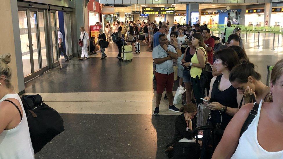 Passengers queuing inside Valencia Airport