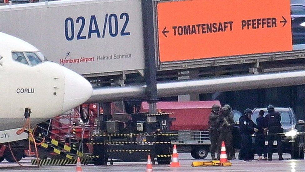 Special forces detain a suspect after a man drove through a barrier on to the grounds of the city's airport with a child in his car in Hamburg, Germany, 5 November 2023