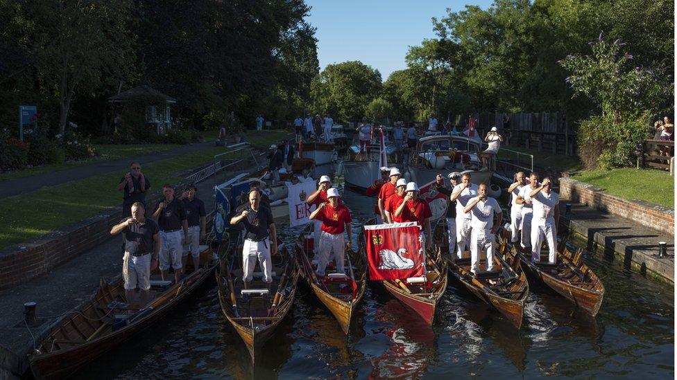 The Swan Marker and his team set off in boats to count the swans.