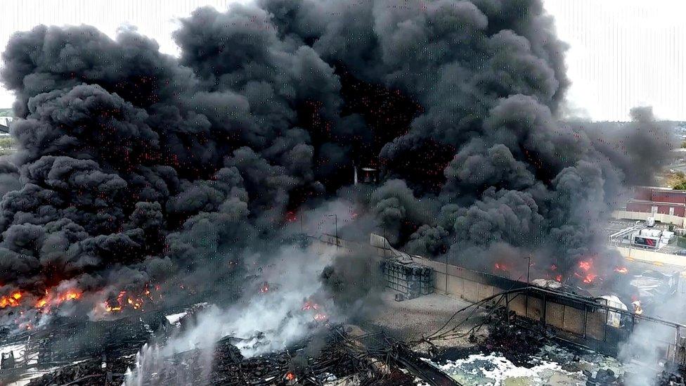 Firefighters at the scene of a blaze at a Lubrizol factory in Rouen, north-western France, 27 September 2019