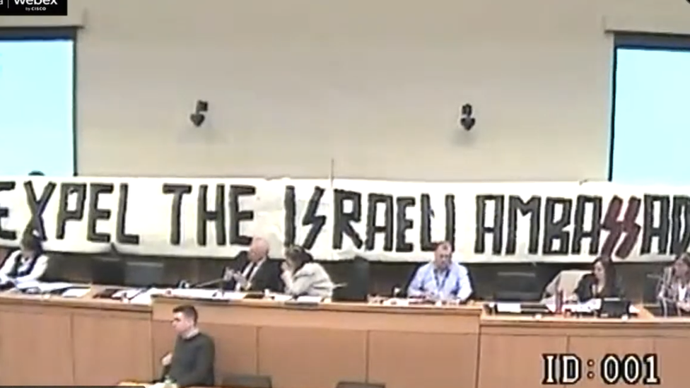 the banner unveield at derry council by pro palestine protestors