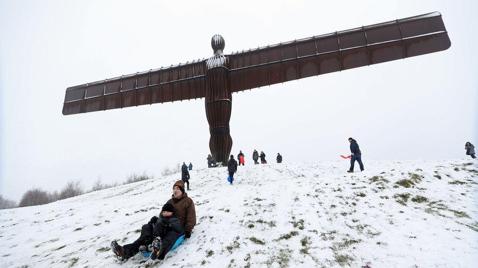 Sledging under the Angel of the North in Gateshead