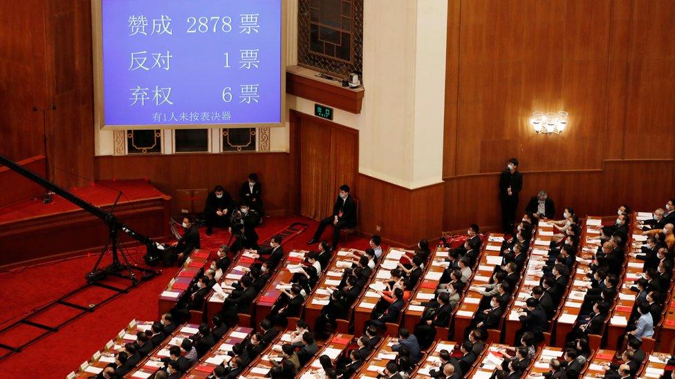 A screen shows the results of the vote on the national security legislation for Hong Kong Special Administrative Region at the closing session of the National People"s Congress