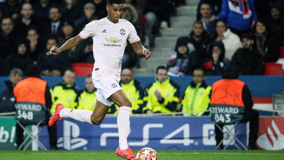 Manchester United"s English forward Marcus Rashford runs with the ball during the UEFA Champions League round of 16 second-leg football match between Paris Saint-Germain (PSG) and Manchester United