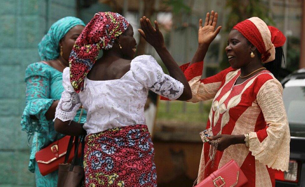 Relatives of the rescued Chibok girls greet each other as they wait to be reunited with their children in Abuja, Nigeria May 20, 2017.