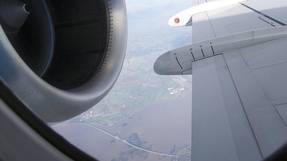 View from passenger aeroplane above Severn Bridge and Wales