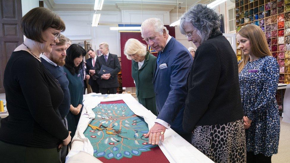 the King and Queen looking at the tree design