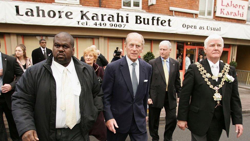 Prince Philip, Duke of Edinburgh tours the Sparkbrook area of Birmingham which was hit by a summer tornado with local resident Rohan Green (L), and The Mayor of Birmingham John Hood (R) on November 22, 2005, Birmingham