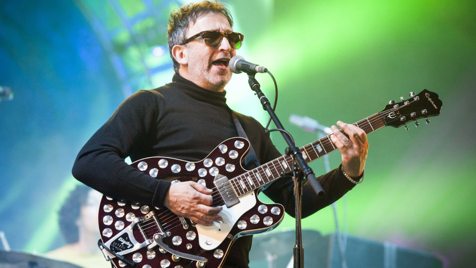 Ian Broudie of the Lightning Seeds with guitar