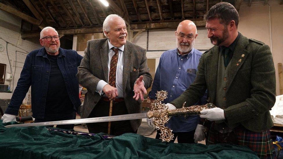 (left to right) Alan Herriot, sword designer Mark Dennis along with the team Pete Waugh and Paul Macdonald as they view the Elizabeth sword which will form part of the Honours of Scotland.