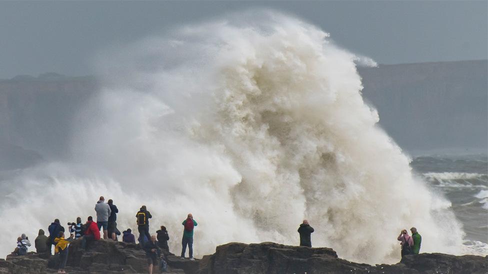 Wave crashing over rocks