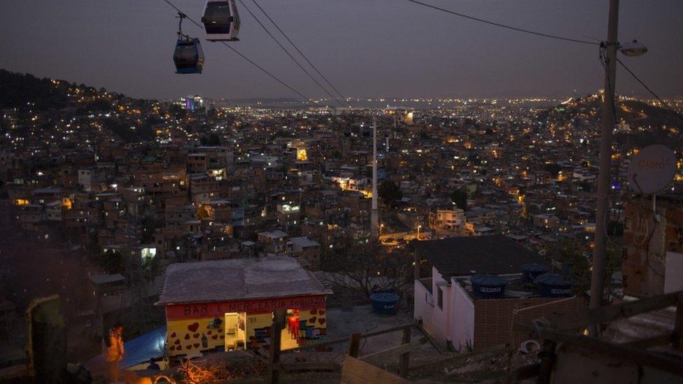 Cable cars transport commuters over the Complexo do Alemao in Rio, July 2016