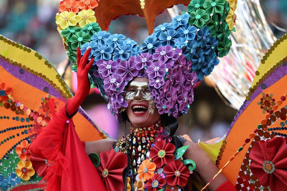 A participant celebrates the Sydney Gay and Lesbian Mardi Gras Parade under coronavirus disease (COVID-19) safety guidelines at the Sydney Cricket Ground in Sydney, Australia, 6 March 2021.