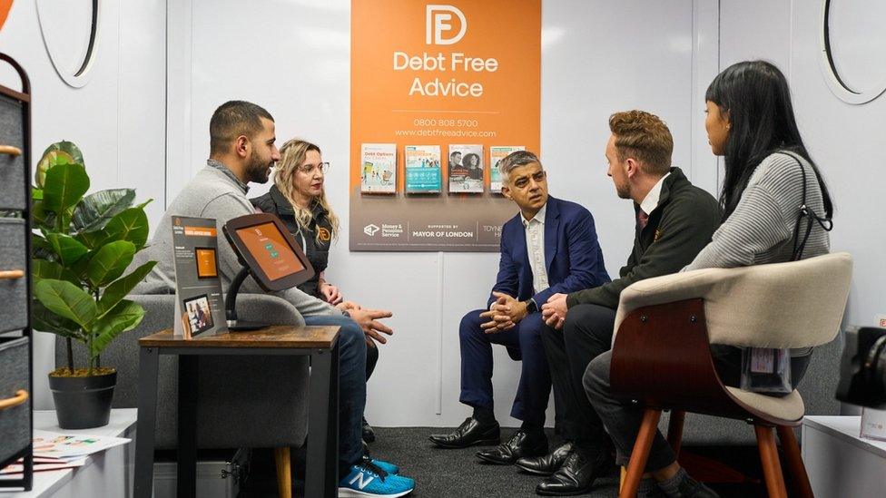 Sadiq Khan and Debt Free Advice inside bus