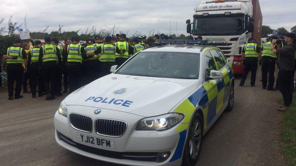 Police helping lorries access the site