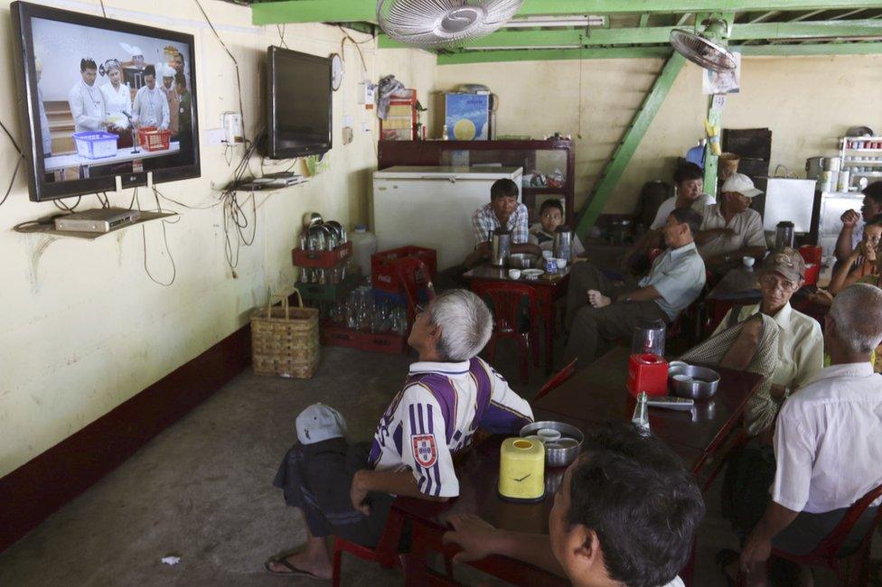 People watch the live broadcast of Myanmar"s presidential election at Parliament Tuesday, 15 March 2016, at a teashop in Yangon, Myanmar