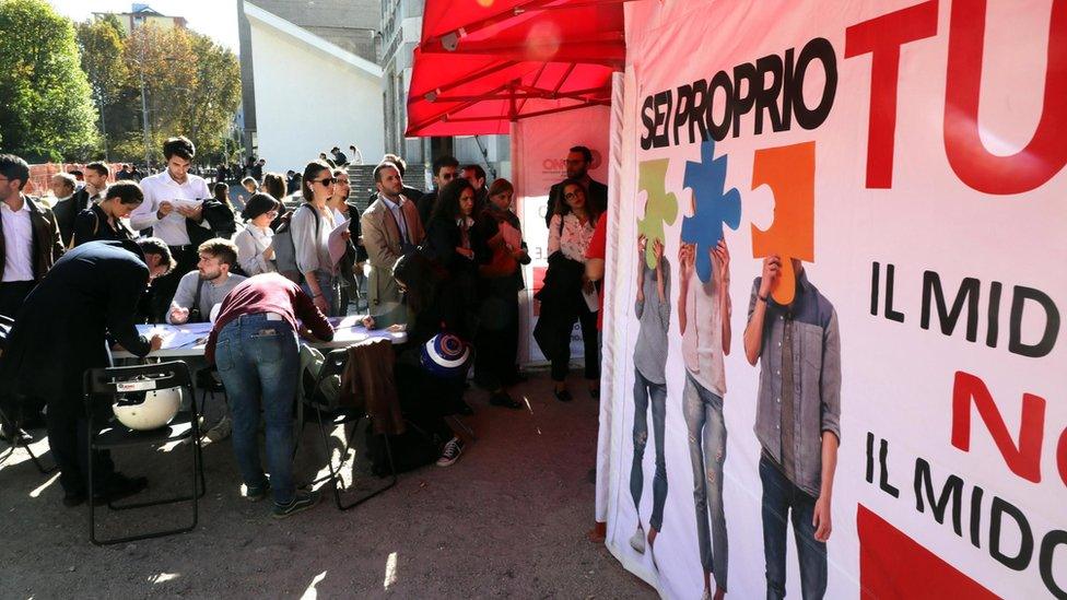 People wait in queues to donate blood and to register on the list of bone marrow donors during the initiative organized by the Bone Marrow Donor Association to respond to the appeal of the parents of little Alex in Milan