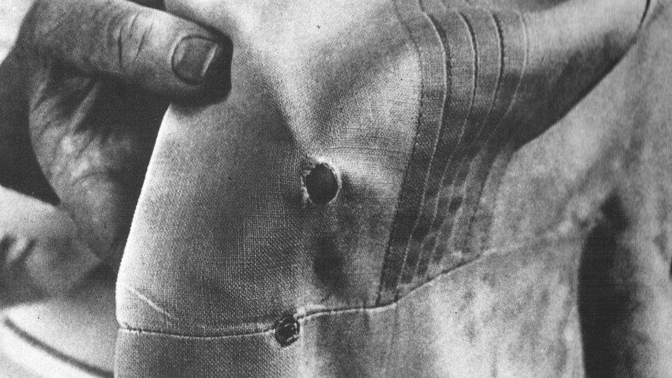 Bullet holes in a nurse's uniform