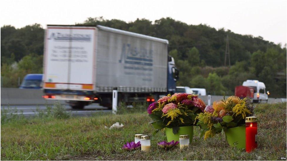 Flowers and candles are left by the side of the A4 motorway, in Nickelsdorf