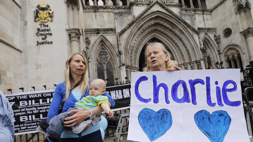 People gather outside the High Court in support of continued medical treatment for critically-ill 11-month old Charlie Gard who is due to be taken off life support, in central London on July 13, 2017.