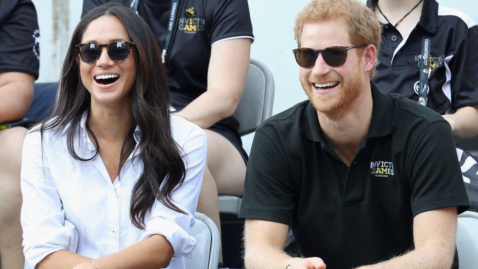 Meghan and Prince Harry sit together at the Invictus Games