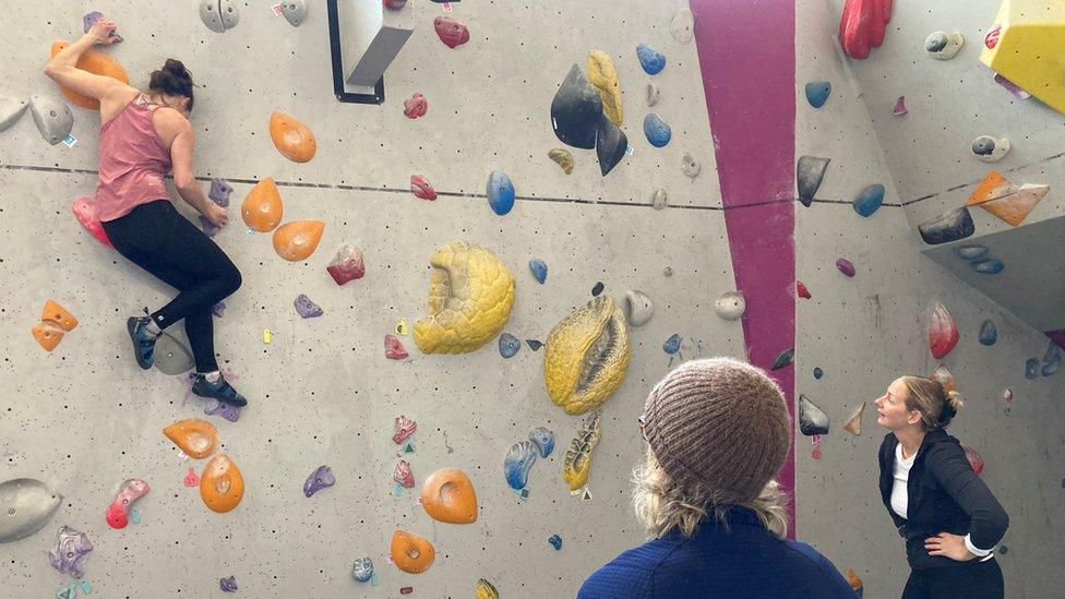 woman at climbing wall