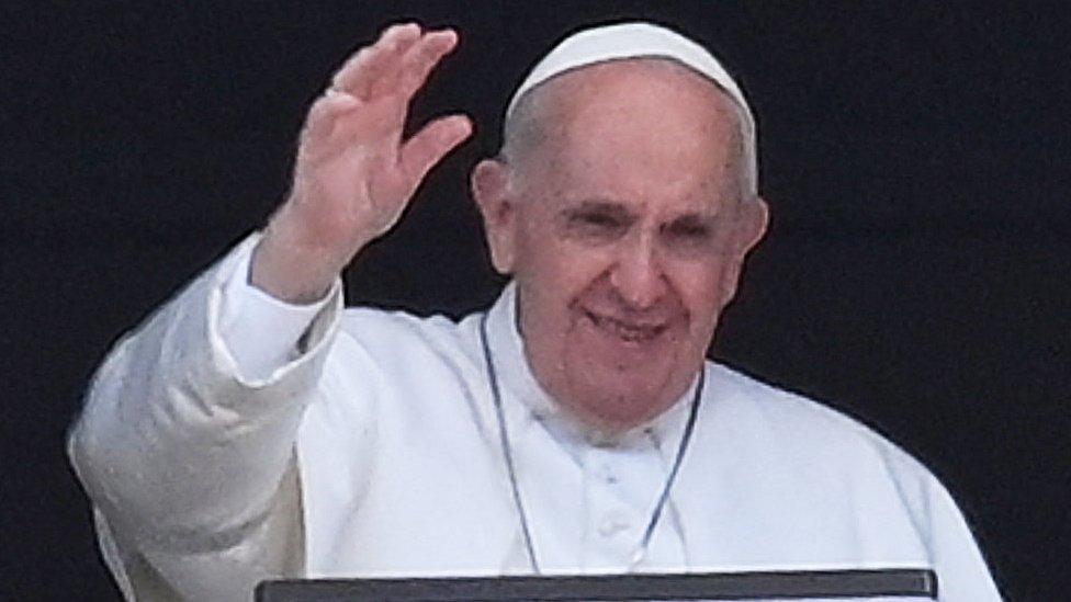 The Pope waves from the window of his study overlooking St.Peter's Square at the Vatican on July 4, 2021