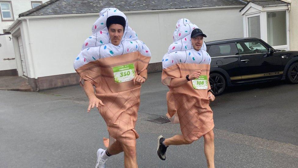 Two men dressed as ice creams running a marathon