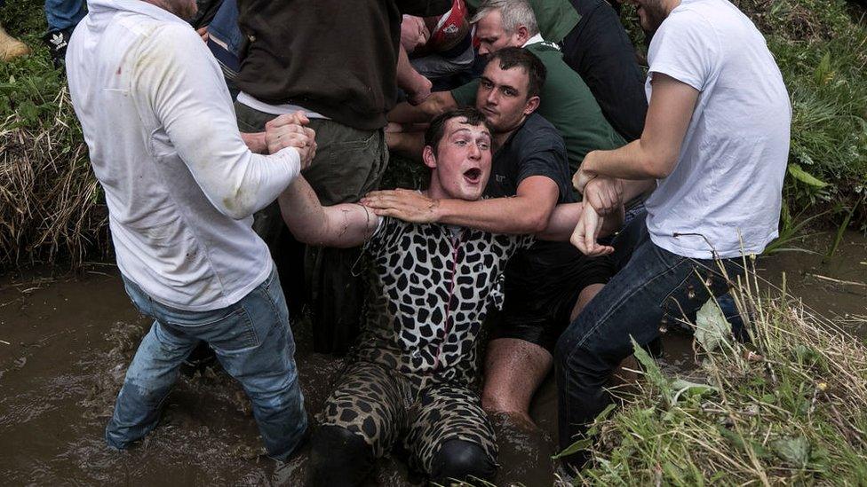 A goal is scored by a man in a cow onesie