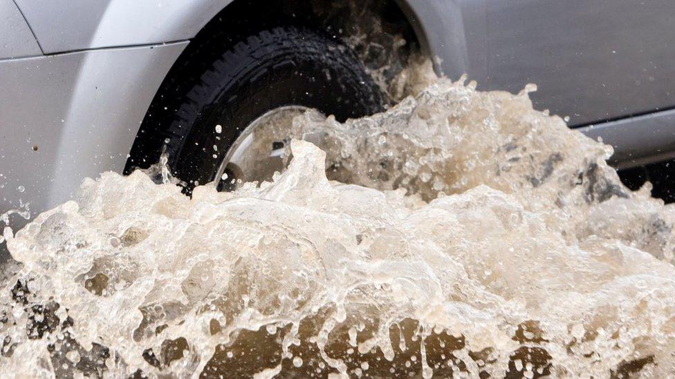 Car wheel and water - generic picture