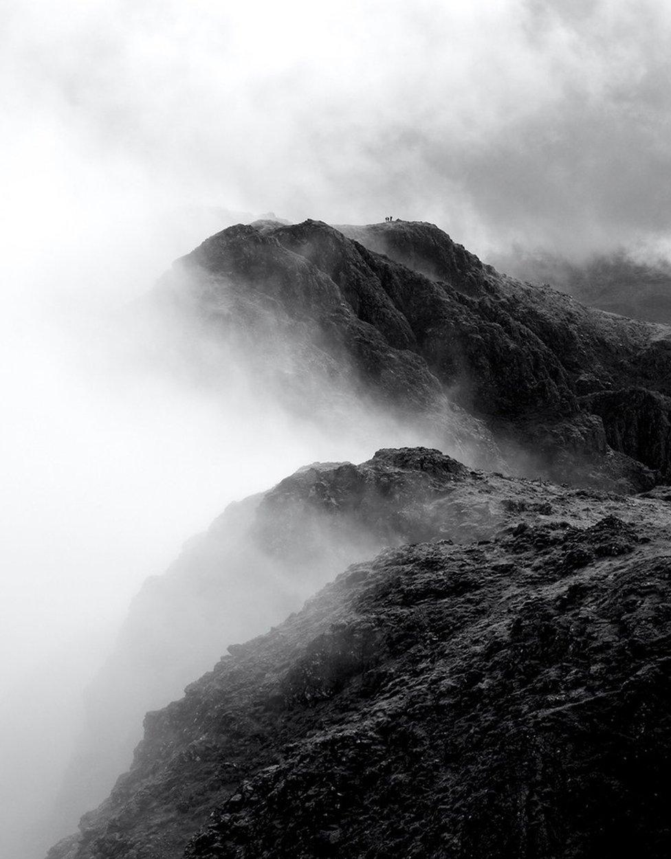 Morning mist lifts on the Aonach Eagach ridge