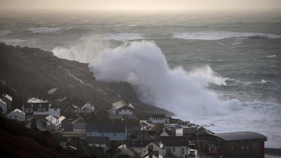 Waves crash over the cliffs at Sennen near Land"s End on February 8, 2016 in Cornwall, England. Parts of the UK are currently being battered by Storm Imogen, the ninth named storm to hit the UK this season. Thousands of homes have been left without power and commuters hit by road and rail chaos as Storm Imogen batters the South with gale force winds and torrential rain.