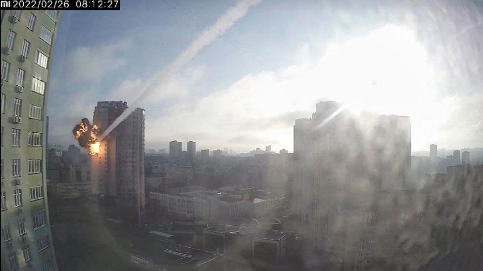 Surveillance footage shows a missile hitting a residential building in Kyiv, Ukraine, February 26, 2022, in this still image taken from a video obtained by REUTERS.