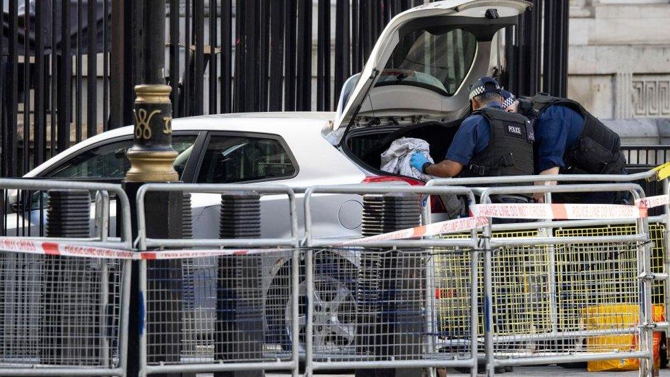 Police seen searching the car