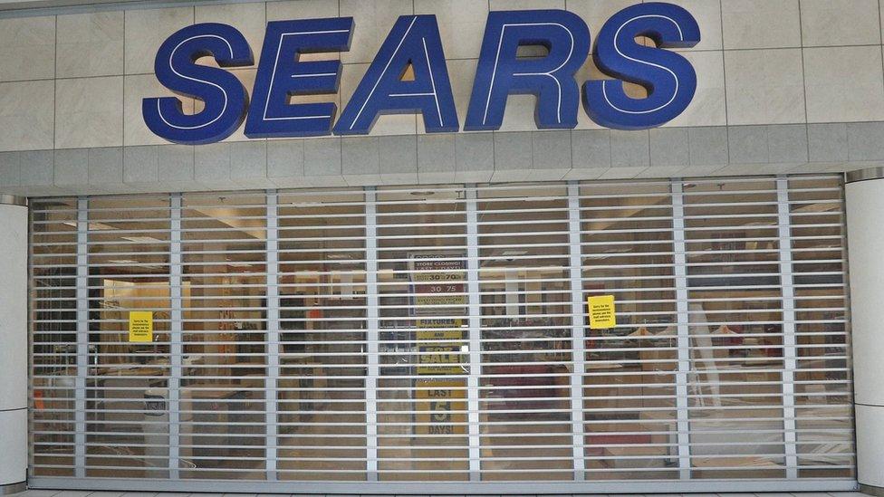 Metal gates block one of the entrances to a Sears store that is closing on September 5, 2017 in Provo, Utah.