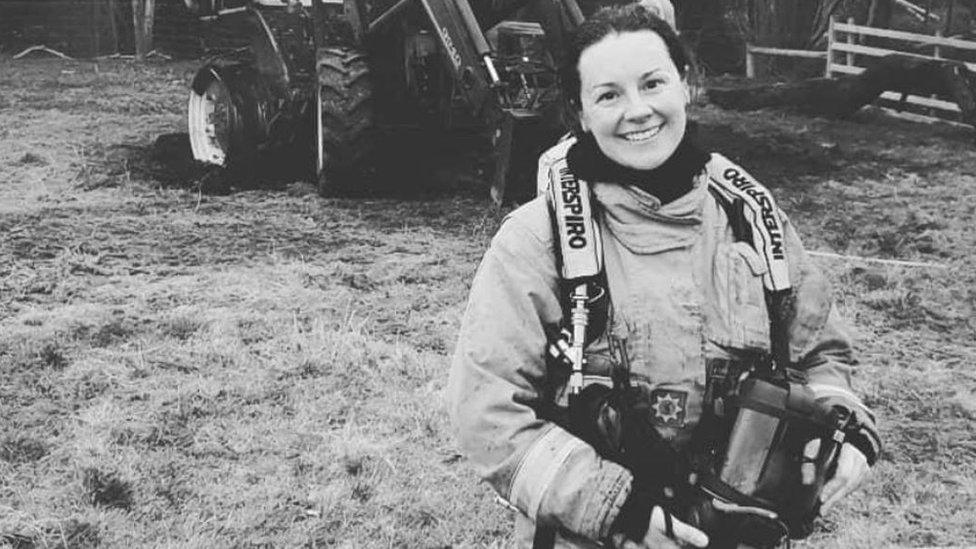 Black and white photo of Alex Sienisi in fire service uniform