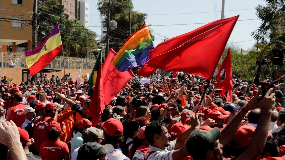 Supporters of former Brazilian President Luiz Inacio Lula da Silva, await his testimony at the Federal Court in Curitiba,