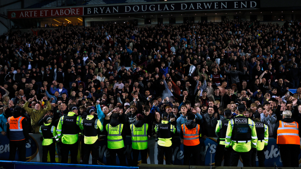 Police officers prevent fans from invading the pitch following the Sky Bet Championship match at Ewood Park, Blackburn