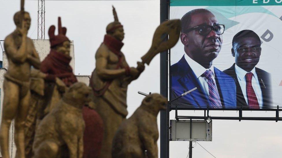 This photograph taken on September 19, 2020 shows a billboard showing incumbent governor of Edo State and candidate of Peoples Democratic Party (PDP) Godwin Obaseki and deputy Philip Shaibu during the Edo State governorship elections