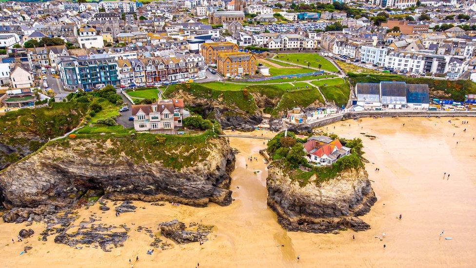 Aerial view of houses next to Newquay beach