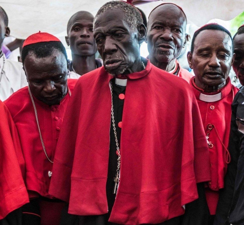 Cardinals of the sect of Legio Maria (Latin for Legion of Mary) attend the funeral service for one of the sects founders, Cardenal Wilson Oweno Obimos, led by Legio Marias own Pope, Raphael Titus (unseen), in the western Kenya town of Kisumu - 9 April 2016