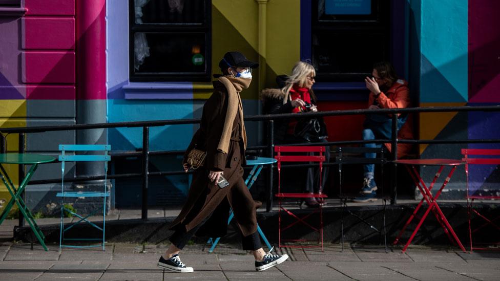 Woman in a mask in Brighton, UK