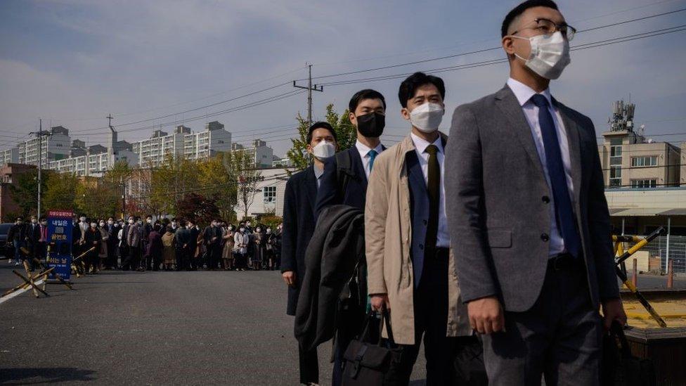 South Korean Jehovah's Witnesses and conscientious objectors to mandatory military service line up to enter a correctional facility to begin training as administrators, in Daejeon on October 26, 2020