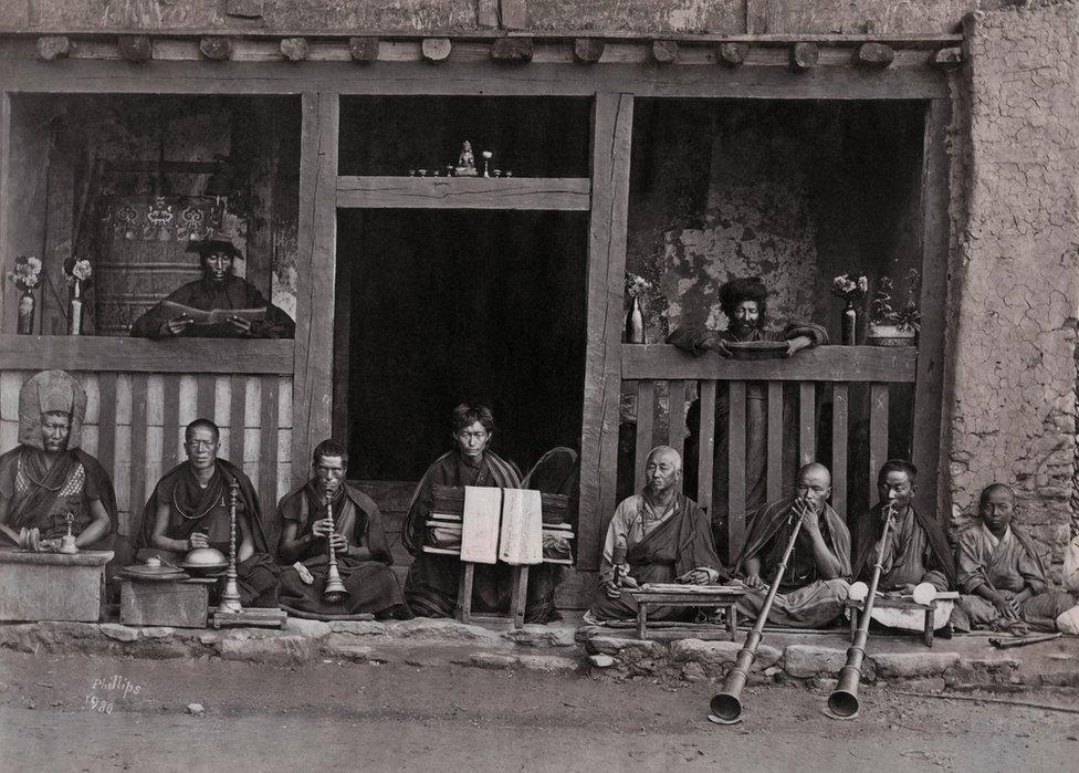 A row of buddhist Musicians, Darjeeling