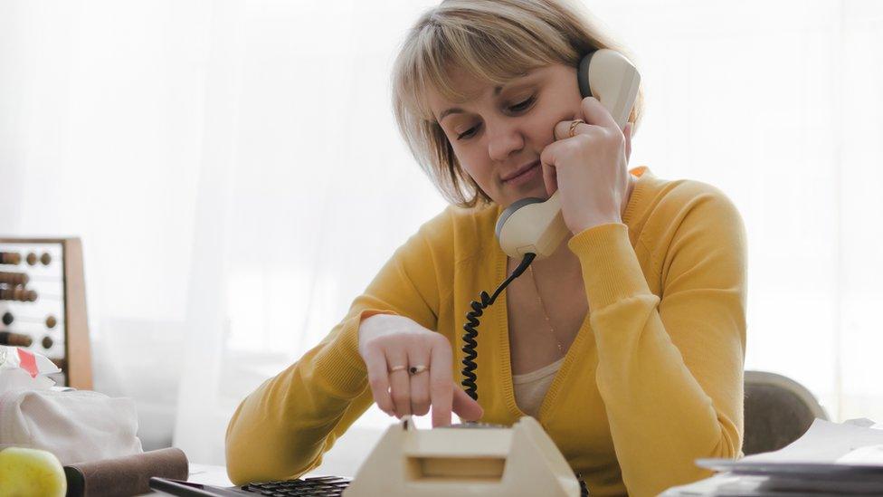 woman on landline phone