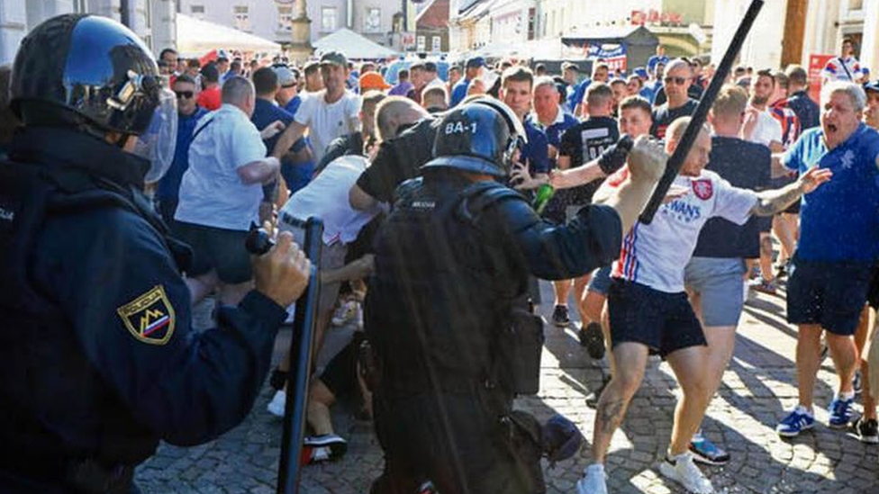 Riot police clash with Rangers fans