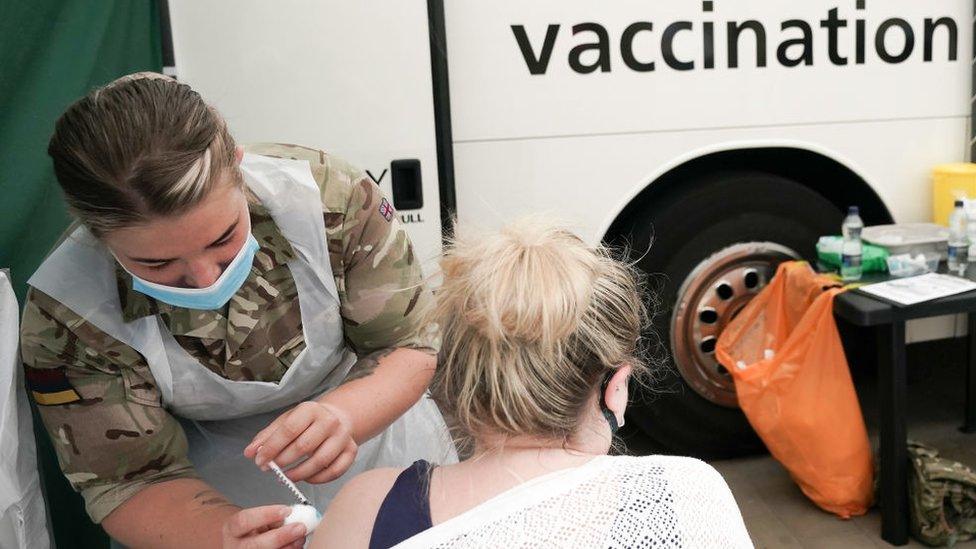 army medic giving vaccine